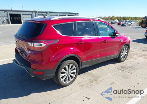 2017 Ford Escape Titanium z USA, uszkodzony, nr VIN 1FMCU0J90HUB46641